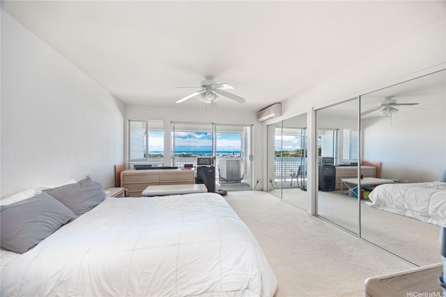 1305 Moanalualani Pl Unit 25C, Honolulu, HI 96819 - carpeted bedroom with a wall mounted air conditioner, ceiling fan, access to exterior, and two closets