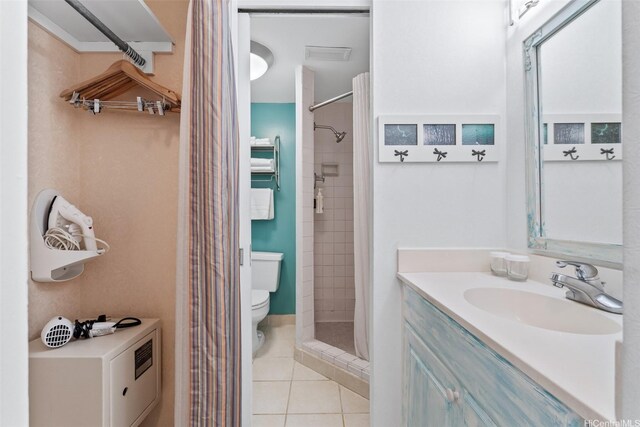 444 Kanekapolei St Unit 208, Honolulu, HI 96815 - bathroom with toilet, tile patterned floors, a stall shower, and vanity