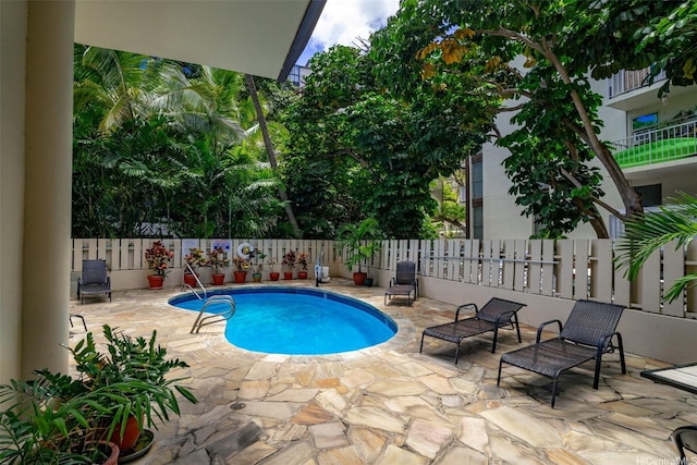 444 Kanekapolei St Unit 208, Honolulu, HI 96815 - view of swimming pool with fence and a patio
