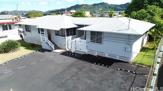 45-510 Pahia Rd, Kaneohe, HI 96744 - view of front of property with fence, a mountain view, and a gate