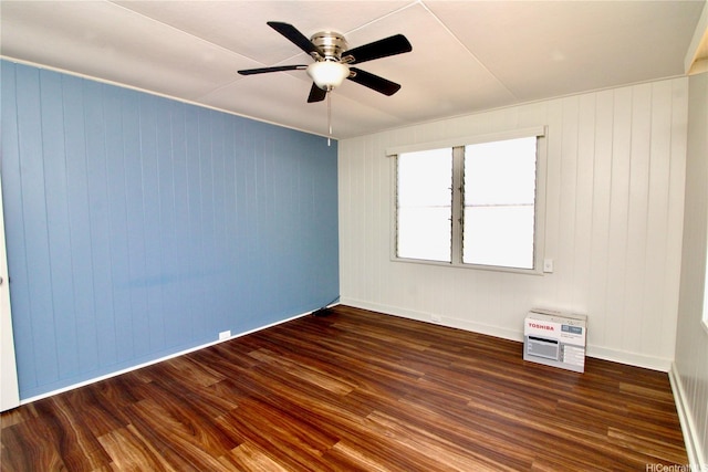 45-510 Pahia Rd, Kaneohe, HI 96744 - spare room with wood finished floors, heating unit, a ceiling fan, and baseboards
