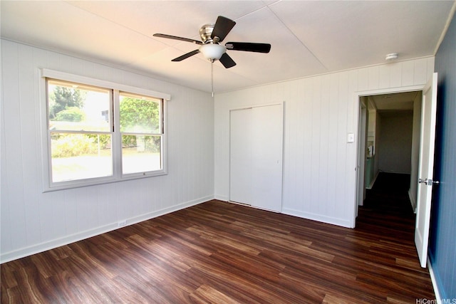 45-510 Pahia Rd, Kaneohe, HI 96744 - unfurnished bedroom with dark wood finished floors, baseboards, a closet, and ceiling fan