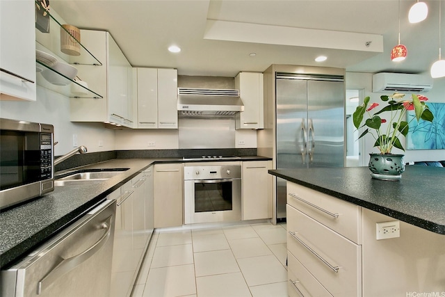 1200 Queen Emma St Unit 1104, Honolulu, HI 96813 - kitchen featuring stainless steel appliances, ventilation hood, an AC wall unit, a sink, and white cabinetry