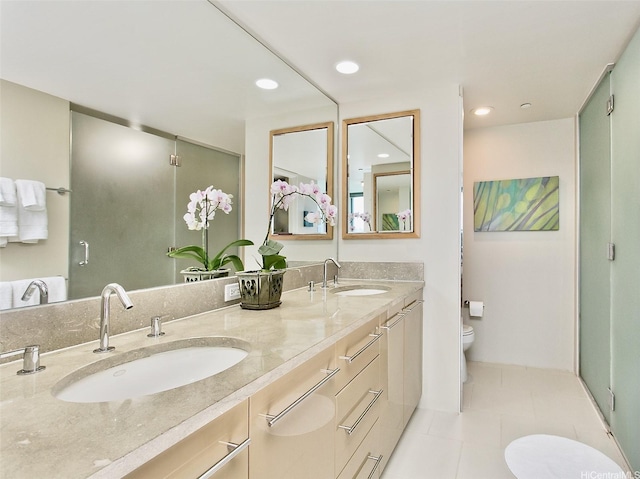 1200 Queen Emma St Unit 1104, Honolulu, HI 96813 - bathroom featuring toilet, double vanity, tile patterned floors, a shower stall, and recessed lighting