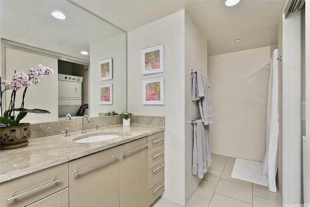 1200 Queen Emma St Unit 1104, Honolulu, HI 96813 - bathroom featuring vanity, stacked washer / drying machine, tile patterned flooring, and recessed lighting