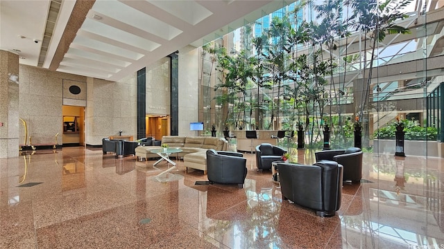 common area featuring a towering ceiling