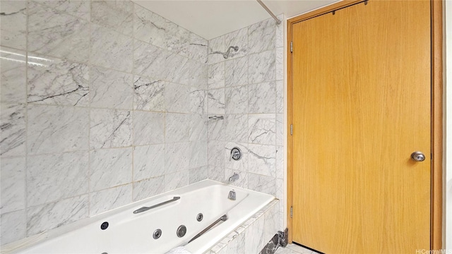 bathroom with a combined bath / shower with jetted tub