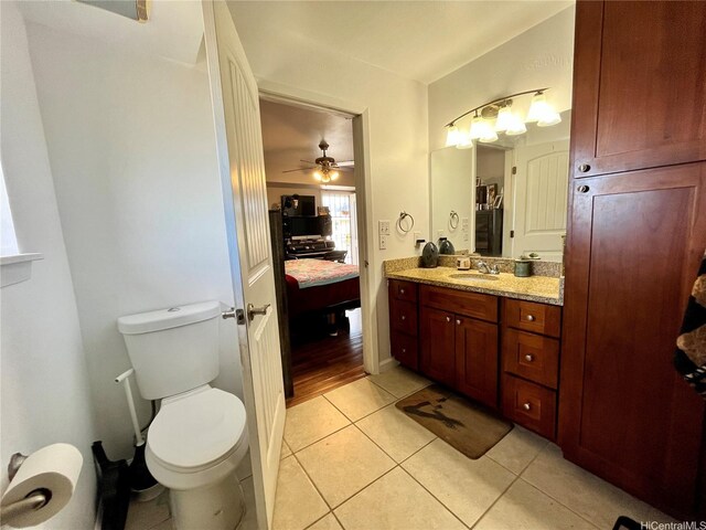 87-176 Maipalaoa Rd Unit C8, Waianae, HI 96792 - bathroom with toilet, tile patterned floors, vanity, a ceiling fan, and ensuite bath