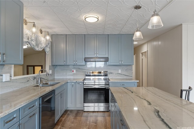 1328 Hele St, Kailua, HI 96734 - kitchen featuring appliances with stainless steel finishes, a sink, under cabinet range hood, dark wood finished floors, and tasteful backsplash