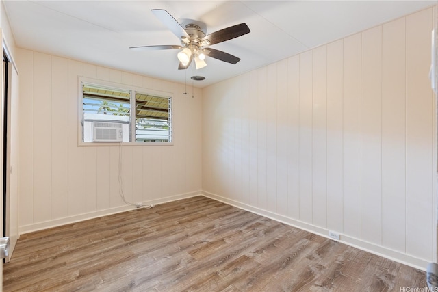 1328 Hele St, Kailua, HI 96734 - empty room featuring light wood finished floors, cooling unit, ceiling fan, and baseboards