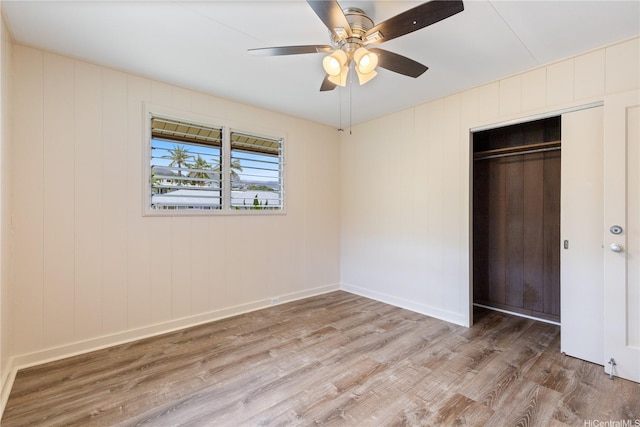 1328 Hele St, Kailua, HI 96734 - unfurnished bedroom with wood finished floors, a closet, baseboards, and a ceiling fan