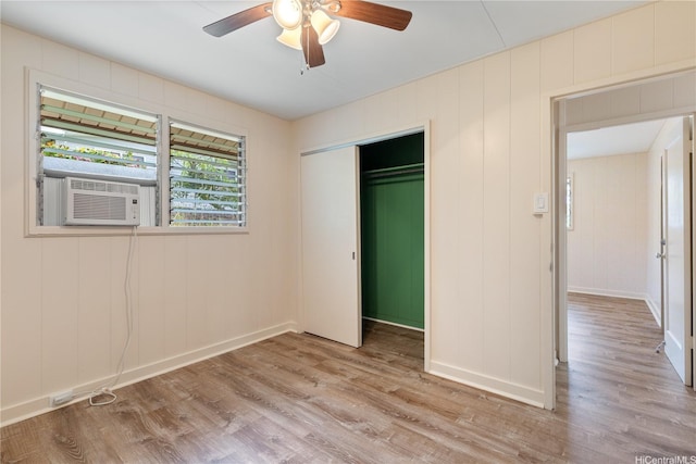 1328 Hele St, Kailua, HI 96734 - unfurnished bedroom with wood finished floors, baseboards, a closet, a ceiling fan, and cooling unit