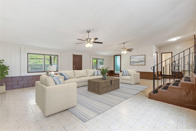 1328 Hele St, Kailua, HI 96734 - living room featuring plenty of natural light, ceiling fan, stairs, a decorative wall, and light floors