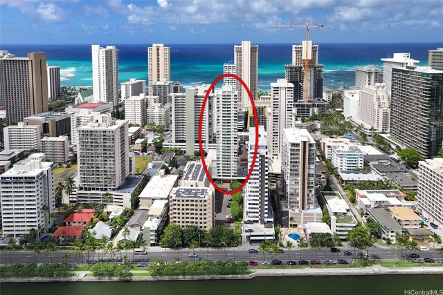 view of urban area featuring a nearby body of water