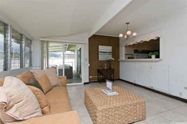 1548 Piikea St, Honolulu, HI 96818 - living area with light tile patterned floors, a chandelier, ornamental molding, wooden walls, and vaulted ceiling
