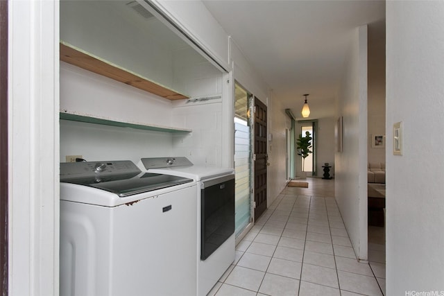 1548 Piikea St, Honolulu, HI 96818 - laundry area featuring washer and clothes dryer and light tile patterned floors