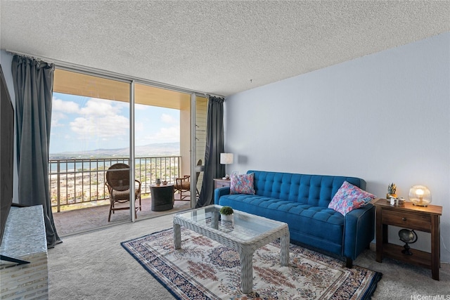98-099 Uao Pl Unit 2408, Aiea, HI 96701 - living room with a wall of windows, carpet, a textured ceiling, and a water view
