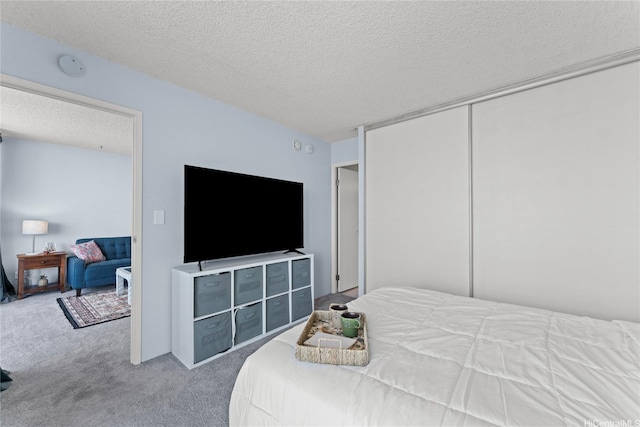 98-099 Uao Pl Unit 2408, Aiea, HI 96701 - bedroom with carpet, a textured ceiling, and a closet