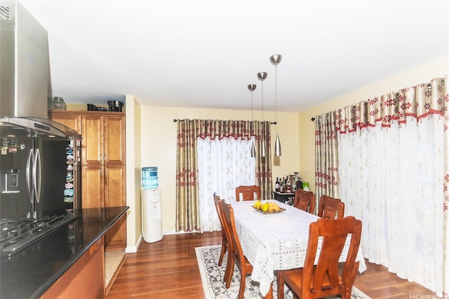 dining area with dark wood-style floors