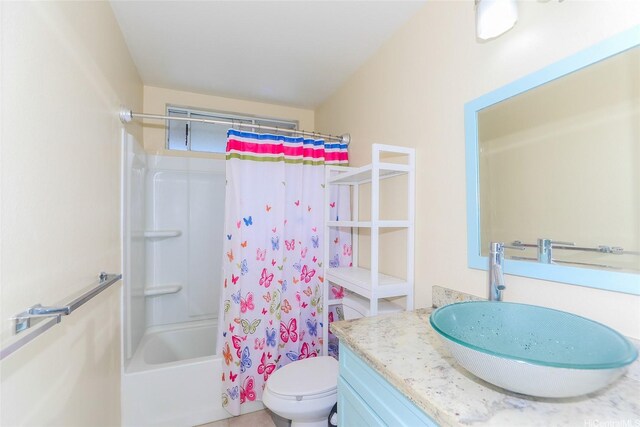 bathroom featuring vanity, toilet, and shower / bathtub combination with curtain
