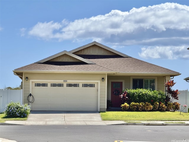 91-1139 Iliahialoe Loop, Ewa Beach, HI 96706 - view of front of property with driveway, an attached garage, and roof with shingles