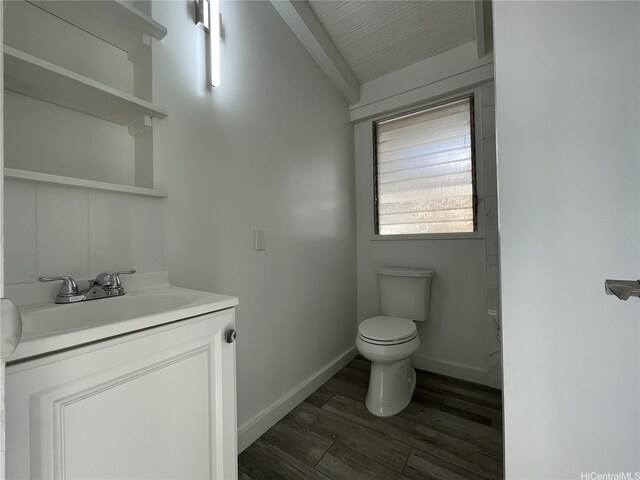 3622 Maunalei Ave, Honolulu, HI 96816 - bathroom featuring toilet, vanity, wood finished floors, and baseboards