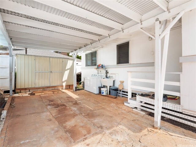 3622 Maunalei Ave, Honolulu, HI 96816 - view of patio / terrace with separate washer and dryer, a storage shed, an outdoor structure, and a sink