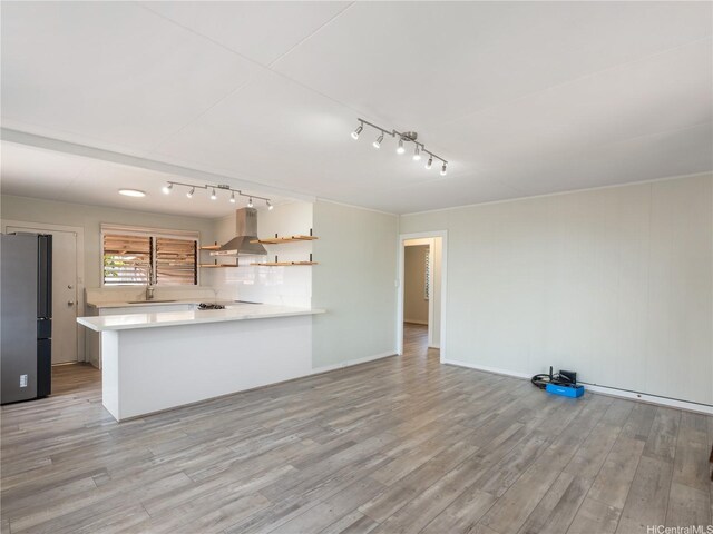 3622 Maunalei Ave, Honolulu, HI 96816 - kitchen with freestanding refrigerator, range hood, open shelves, track lighting, and light countertops