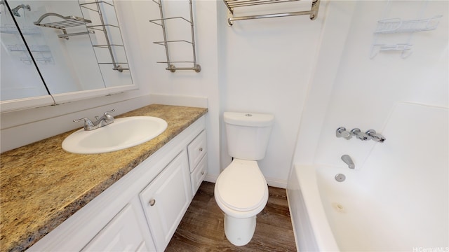 2888 Ala Ilima St Unit 512, Honolulu, HI 96818 - bathroom featuring toilet, wood finished floors, vanity, and bathtub / shower combination