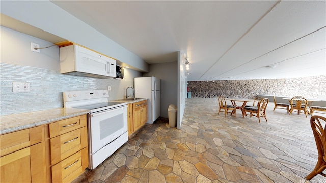 2888 Ala Ilima St Unit 512, Honolulu, HI 96818 - kitchen featuring white appliances, stone flooring, tasteful backsplash, and a sink