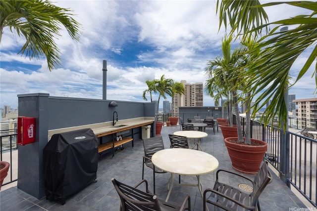 view of patio / terrace featuring area for grilling and a sink