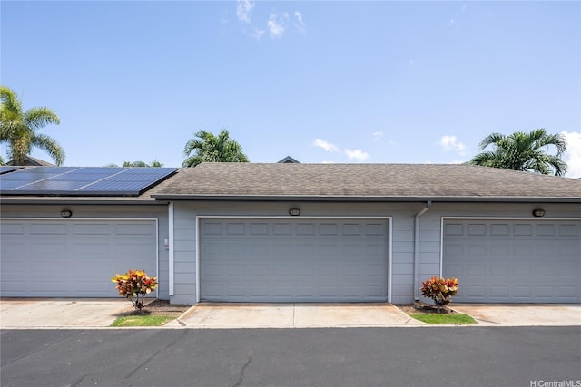 91-1121 Keoneula Blvd Unit L2, Ewa Beach, HI 96706 - garage featuring roof mounted solar panels
