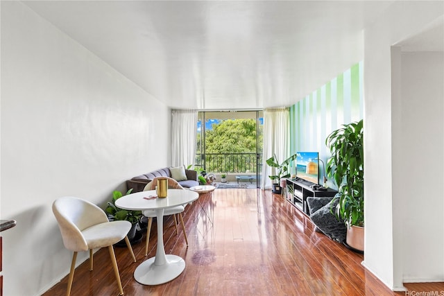440 Seaside Ave Unit 404, Honolulu, HI 96815 - living area featuring wood-type flooring and floor to ceiling windows