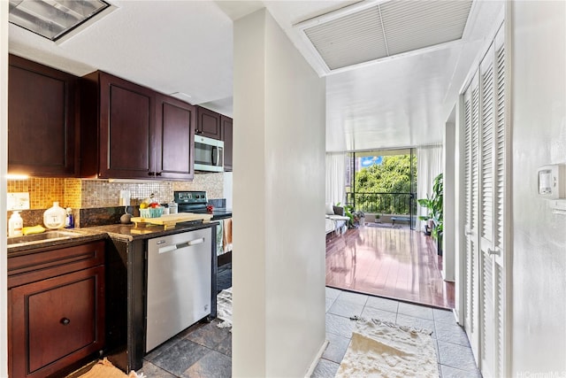 440 Seaside Ave Unit 404, Honolulu, HI 96815 - kitchen featuring appliances with stainless steel finishes, backsplash, and a sink