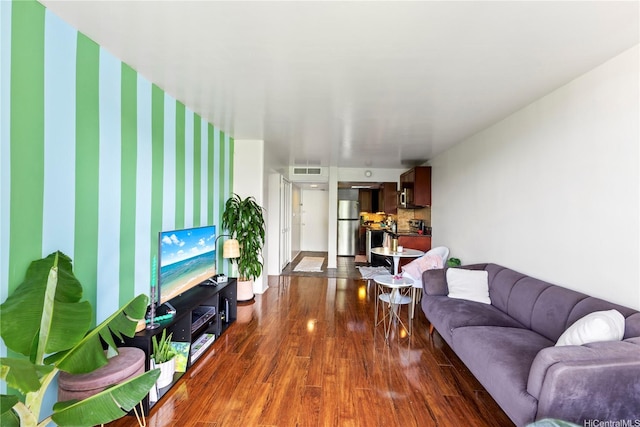 440 Seaside Ave Unit 404, Honolulu, HI 96815 - living area featuring dark wood-style floors, baseboards, and wallpapered walls