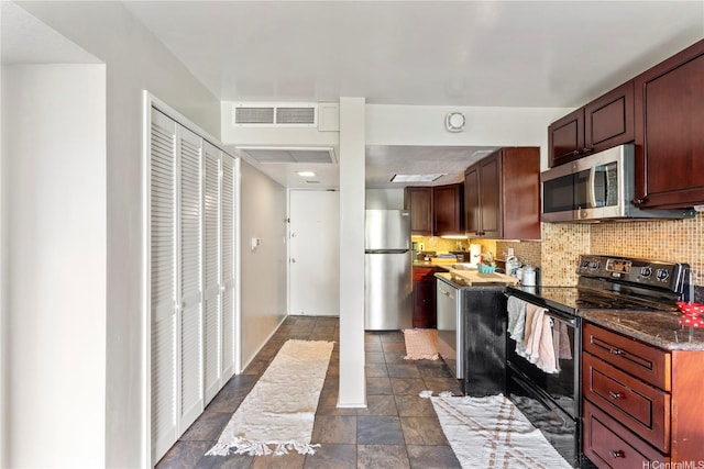 440 Seaside Ave Unit 404, Honolulu, HI 96815 - kitchen featuring stainless steel appliances, tasteful backsplash, and dark stone finish floors
