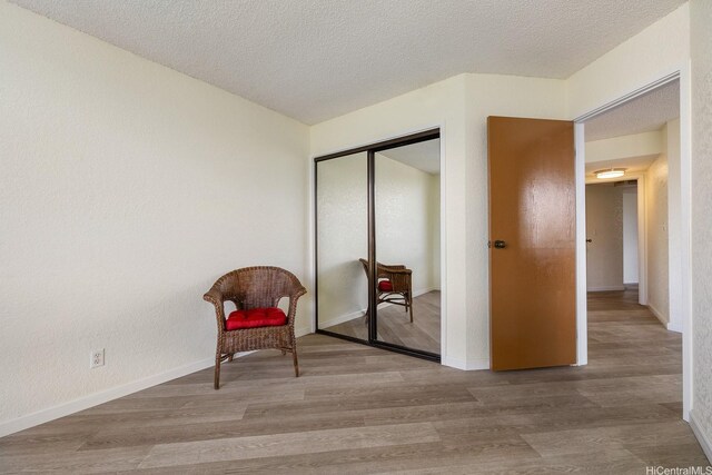 300 Wai Nani Way Unit 1902, Honolulu, HI 96815 - unfurnished room featuring wood finished floors, a textured ceiling, and baseboards
