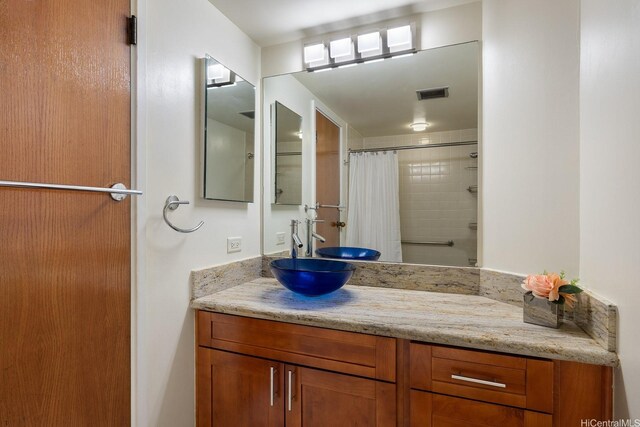 300 Wai Nani Way Unit 1902, Honolulu, HI 96815 - bathroom featuring vanity and a shower with shower curtain