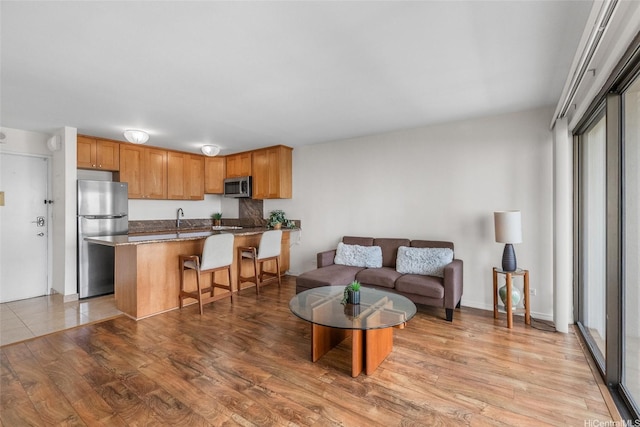 living area featuring light wood finished floors