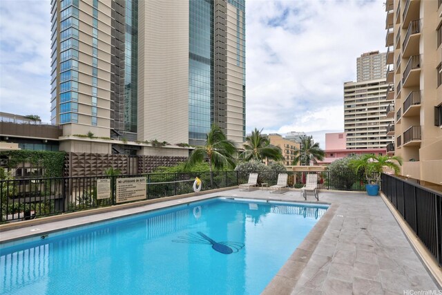 community pool featuring fence