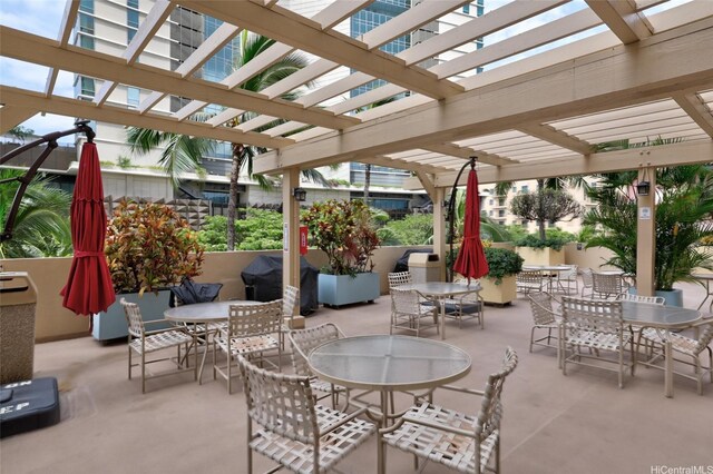 view of patio / terrace featuring outdoor dining area, a pergola, and grilling area
