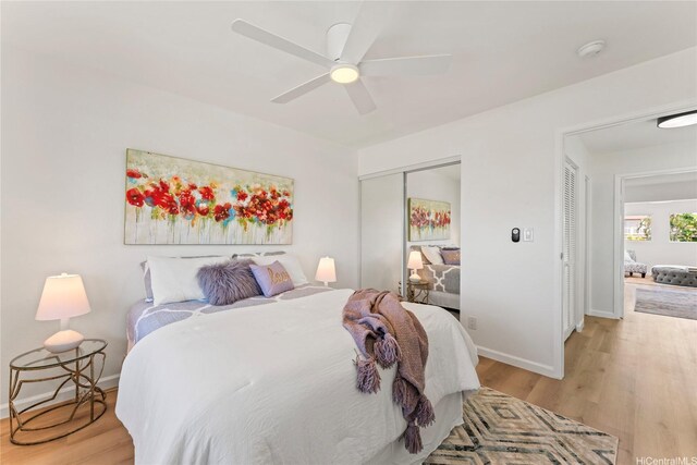 94-78 Aaahi Pl, Mililani, HI 96789 - bedroom with light wood finished floors, baseboards, a closet, and ceiling fan