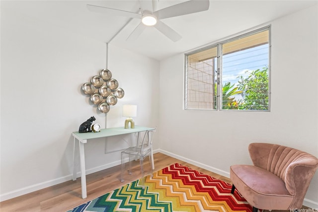 94-78 Aaahi Pl, Mililani, HI 96789 - living area with wood finished floors, baseboards, ceiling fan, and an office area
