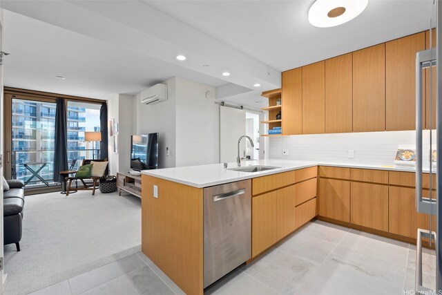 1388 Kapiolani Blvd Unit 2702, Honolulu, HI 96814 - kitchen with dishwasher, a sink, a wall unit AC, a peninsula, and light countertops