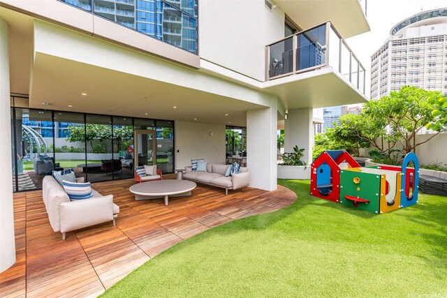 1388 Kapiolani Blvd Unit 2702, Honolulu, HI 96814 - view of property's community with an outdoor hangout area, a wooden deck, and a lawn