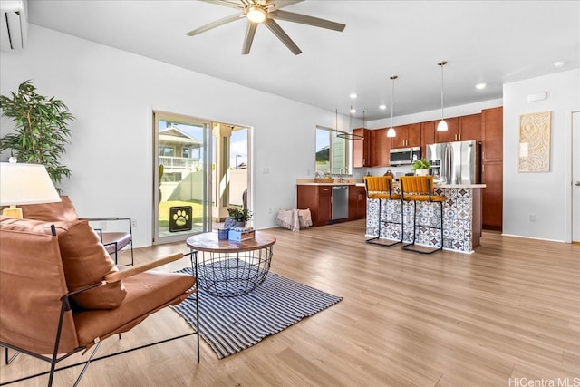 91-3390 Maohiohi Loop, Ewa Beach, HI 96706 - living room featuring a ceiling fan, healthy amount of natural light, light wood-type flooring, and recessed lighting