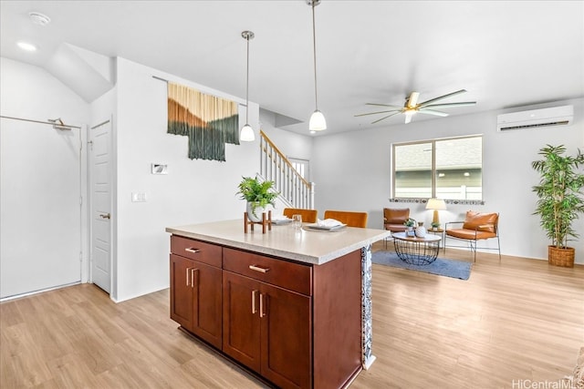 91-3390 Maohiohi Loop, Ewa Beach, HI 96706 - kitchen with a wall mounted AC, light wood-style flooring, a ceiling fan, light countertops, and hanging light fixtures