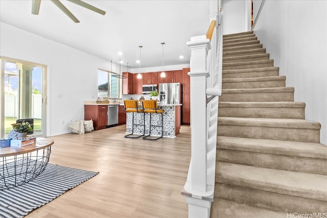 91-3390 Maohiohi Loop, Ewa Beach, HI 96706 - staircase with wood finished floors, ceiling fan, and recessed lighting