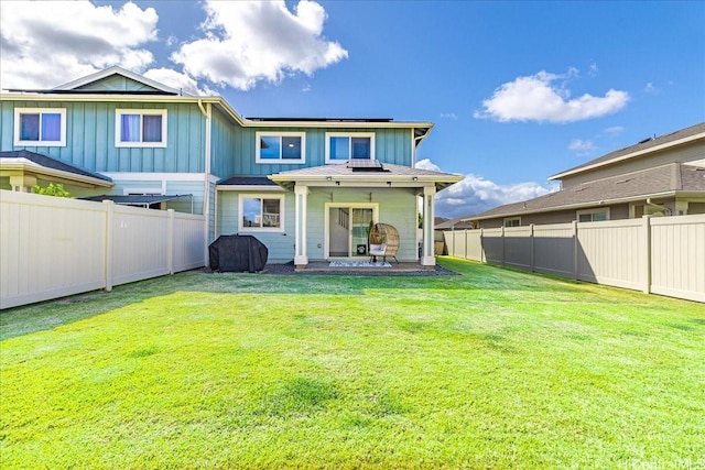 91-3390 Maohiohi Loop, Ewa Beach, HI 96706 - rear view of house with board and batten siding and a patio area