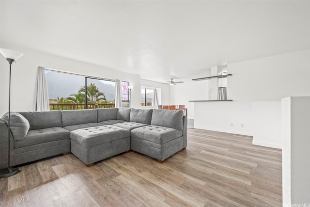 46-010 Aliikane Pl Unit 211, Kaneohe, HI 96744 - living area featuring light wood-style floors and a ceiling fan